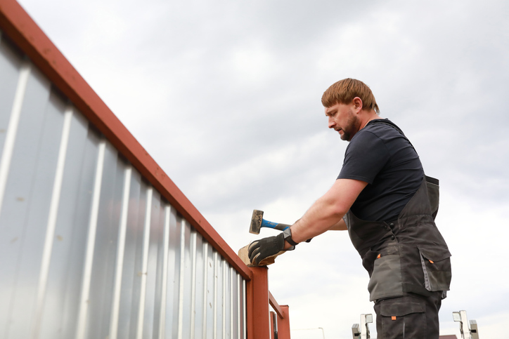 fence installation worker