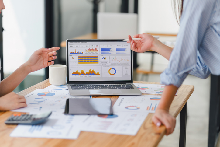 Two data analysts Working on data analysis dashboard for business strategy