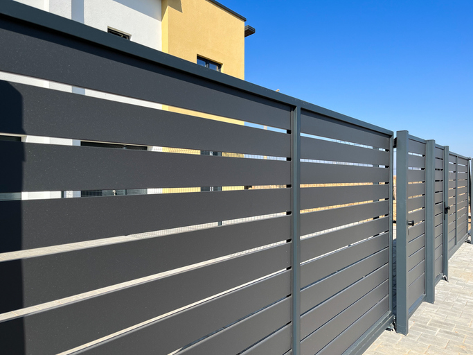 Horizontal sections of the fence made of metal advantages of installing a privacy fence