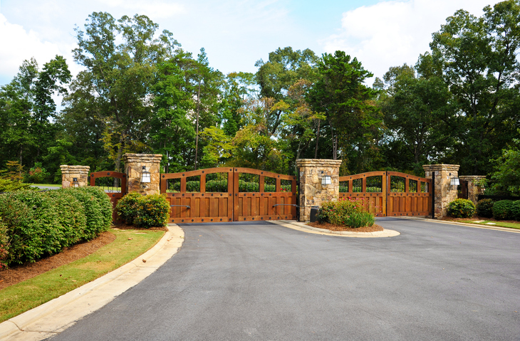 Security Gates DIY vs. professional fence installation stock photo