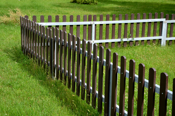 The fence planks are made of recycled plastic and look almost like wood